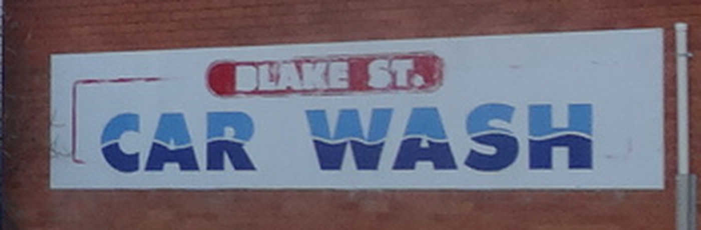 The hand painted Blake St. Car Wash sign on the brick end wall of the building